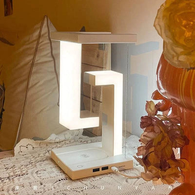 Elegant wireless charging geometric stereo that enhances room aesthetics with a floating design.